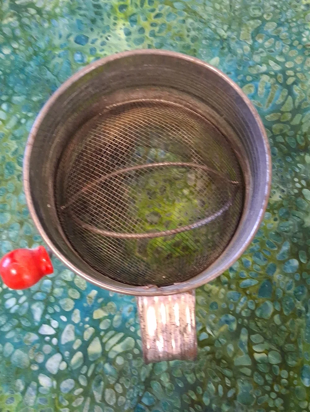 Vintage Cream Metal Flour Sifter with Red Apple Motif